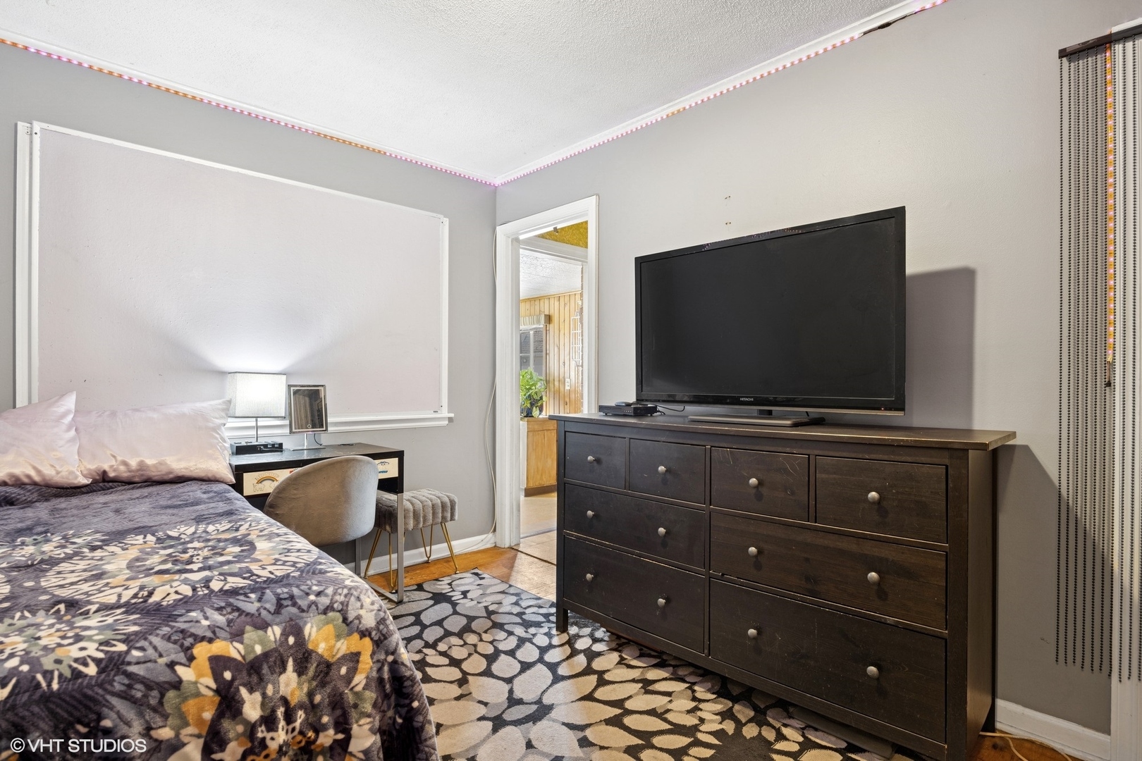 1315 Webster Lane Des Plaines, IL 60018 - Photo 6 of 18 a bedroom with a bed and a flat screen tv