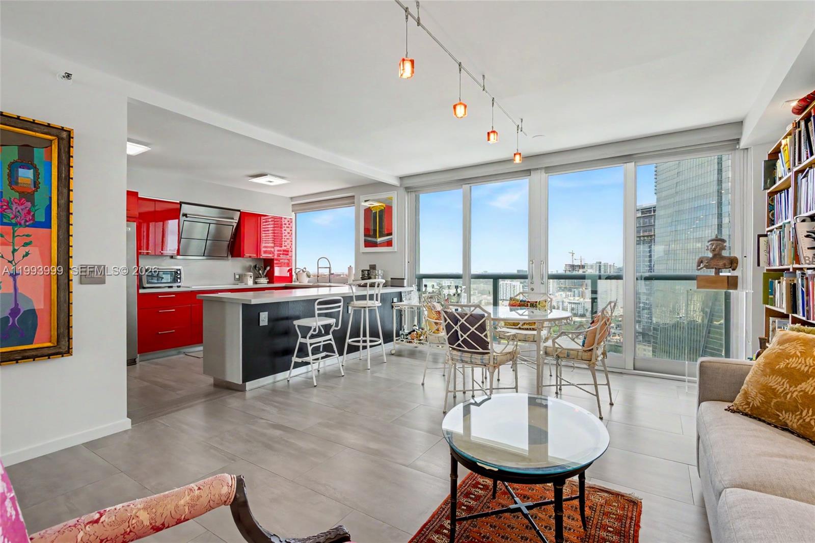 1541 Brickell Avenue, Unit B2904 Miami, FL 33129 - Photo 11 of 47 a living room with lots of furniture and kitchen view