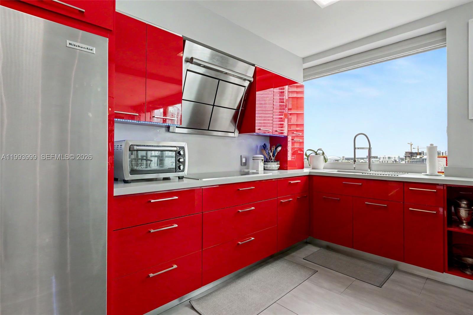 1541 Brickell Avenue, Unit B2904 Miami, FL 33129 - Photo 15 of 47 a kitchen with stainless steel appliances a sink window and cabinets