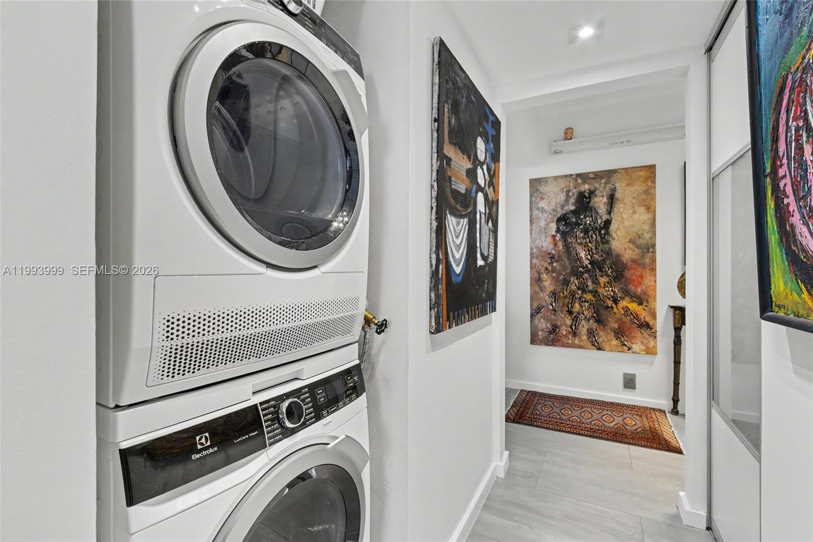 1541 Brickell Avenue, Unit B2904 Miami, FL 33129 - Photo 18 of 47 a view of a hallway with washer and dryer