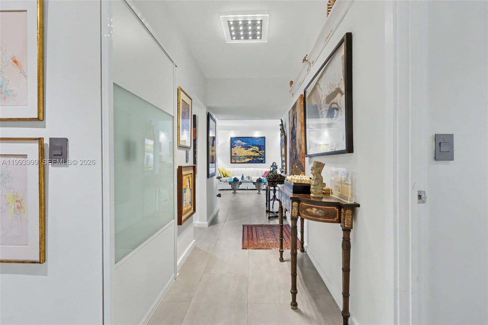1541 Brickell Avenue, Unit B2904 Miami, FL 33129 - Photo 2 of 47 a view of a hallway with workspace and living room