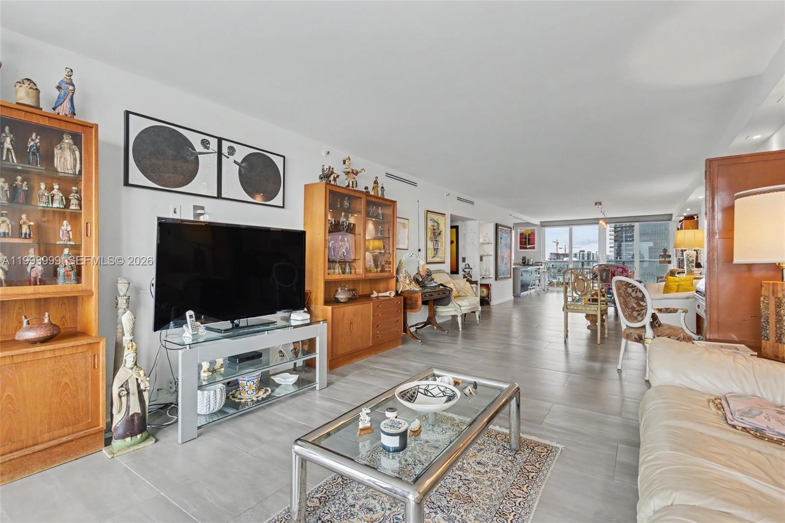 1541 Brickell Avenue, Unit B2904 Miami, FL 33129 - Photo 23 of 47 a living room with furniture and a flat screen tv