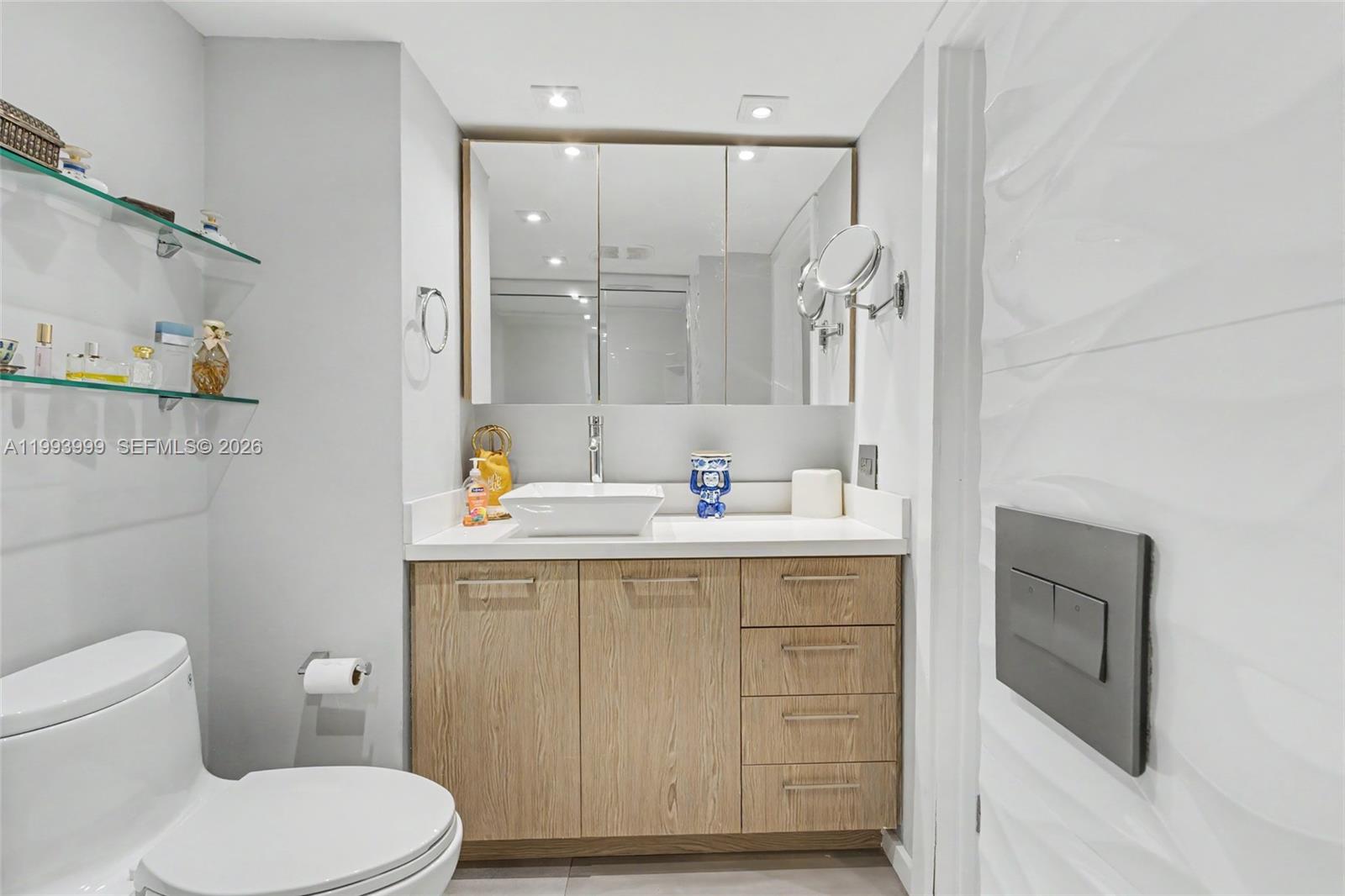 1541 Brickell Avenue, Unit B2904 Miami, FL 33129 - Photo 29 of 47 a bathroom with a sink a toilet and shower