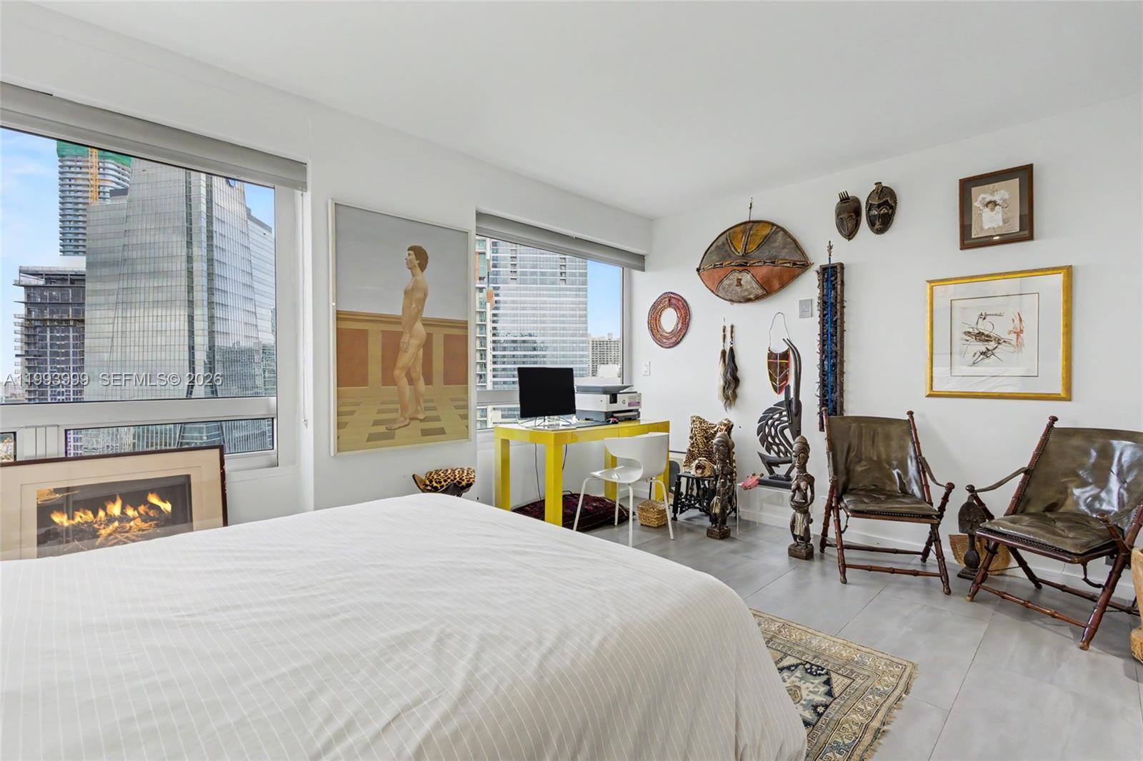 1541 Brickell Avenue, Unit B2904 Miami, FL 33129 - Photo 32 of 47 a bedroom with a bed and dresser with chair