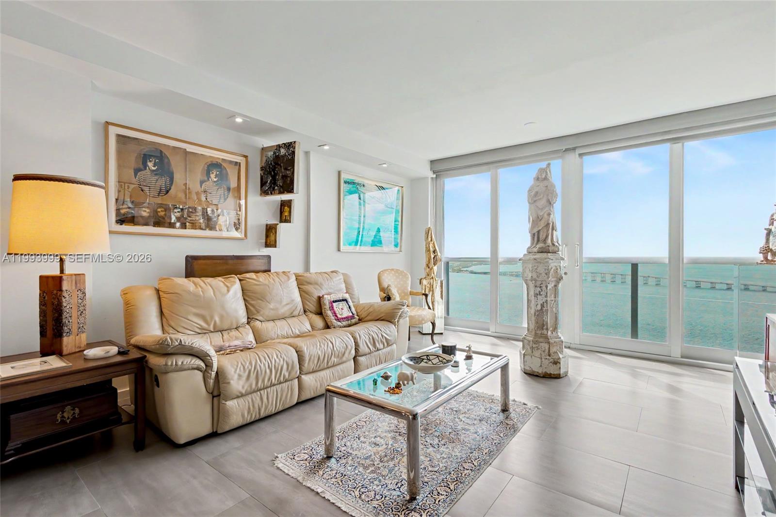 1541 Brickell Avenue, Unit B2904 Miami, FL 33129 - Photo 6 of 47 a living room with furniture and a large window