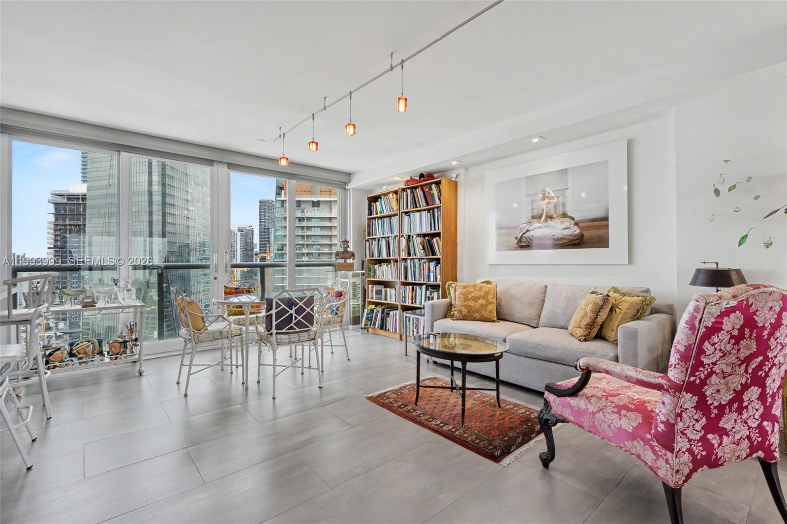 1541 Brickell Avenue, Unit B2904 Miami, FL 33129 - Photo 10 of 47 a living room with furniture and a painting on the wall