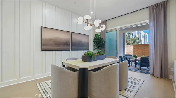 a living room with furniture a window and a flat screen tv