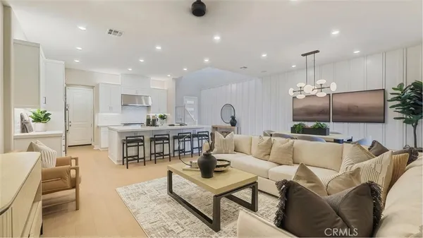a view of a livingroom with furniture and a potted plant
