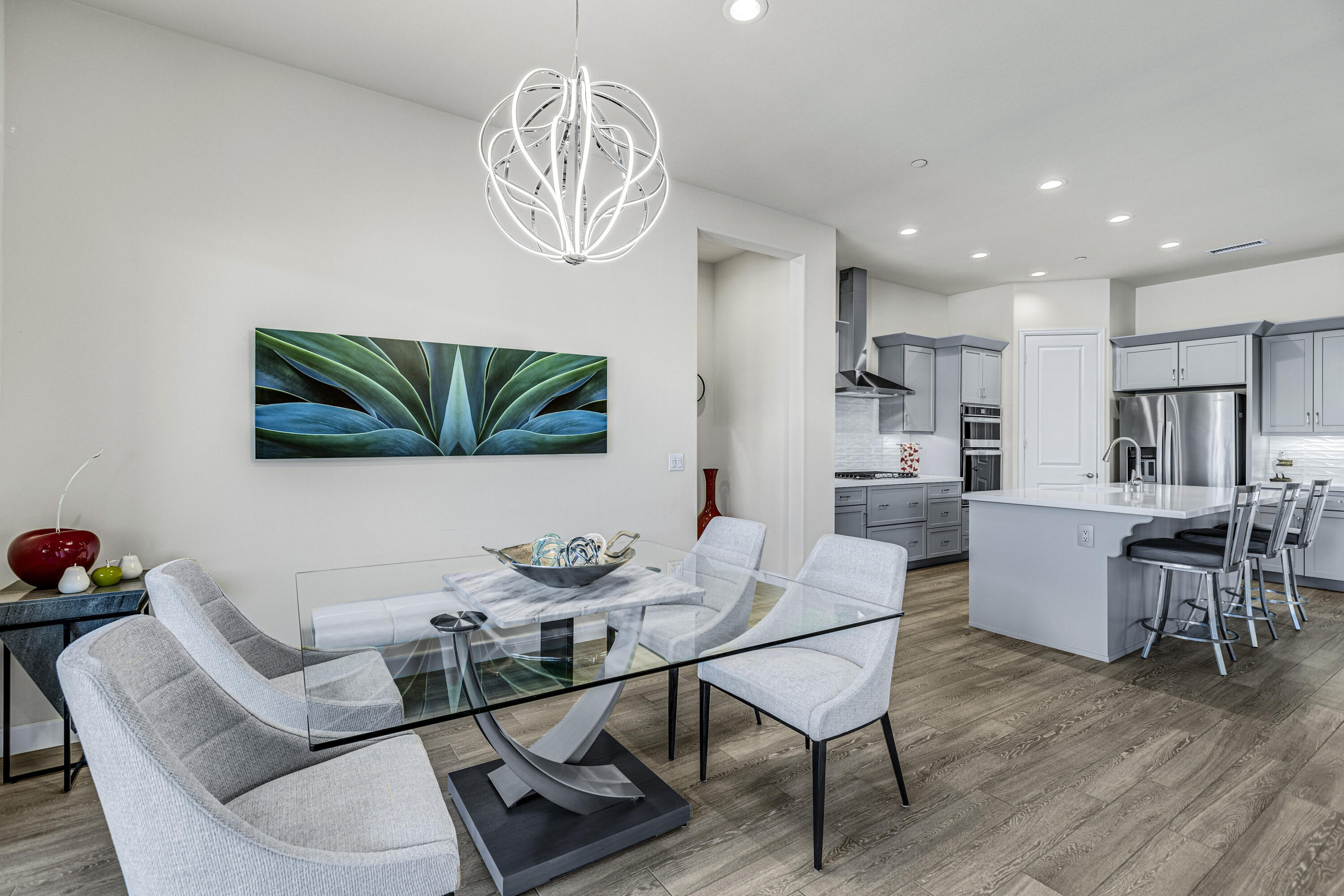 36 Chianti Rancho Mirage, CA 92270 - Photo 16 of 63 a view of a dining room with furniture and wooden floor