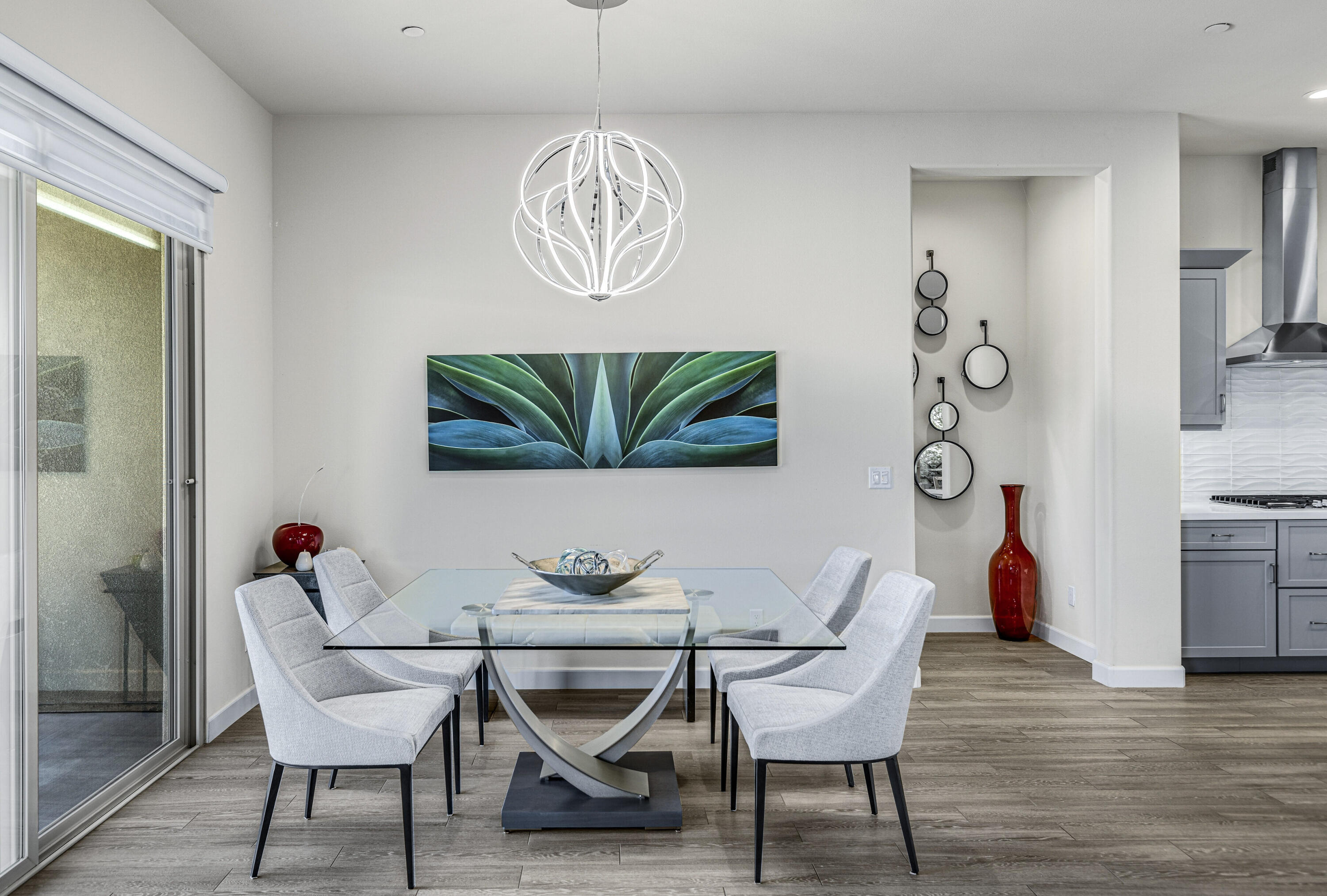 36 Chianti Rancho Mirage, CA 92270 - Photo 18 of 63 a dining room with furniture a rug and wooden floor