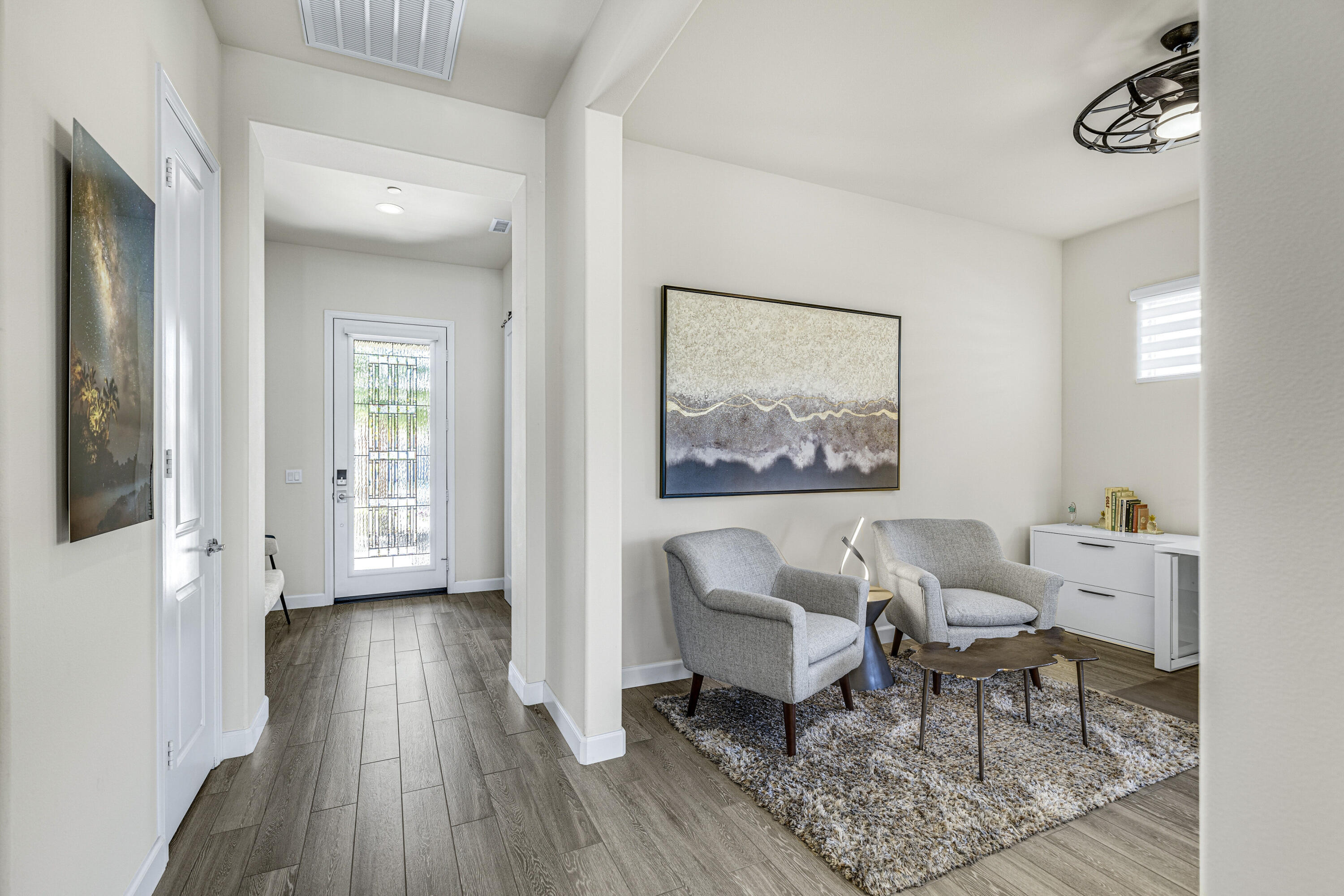 36 Chianti Rancho Mirage, CA 92270 - Photo 35 of 63 a living room with furniture and a wooden floor