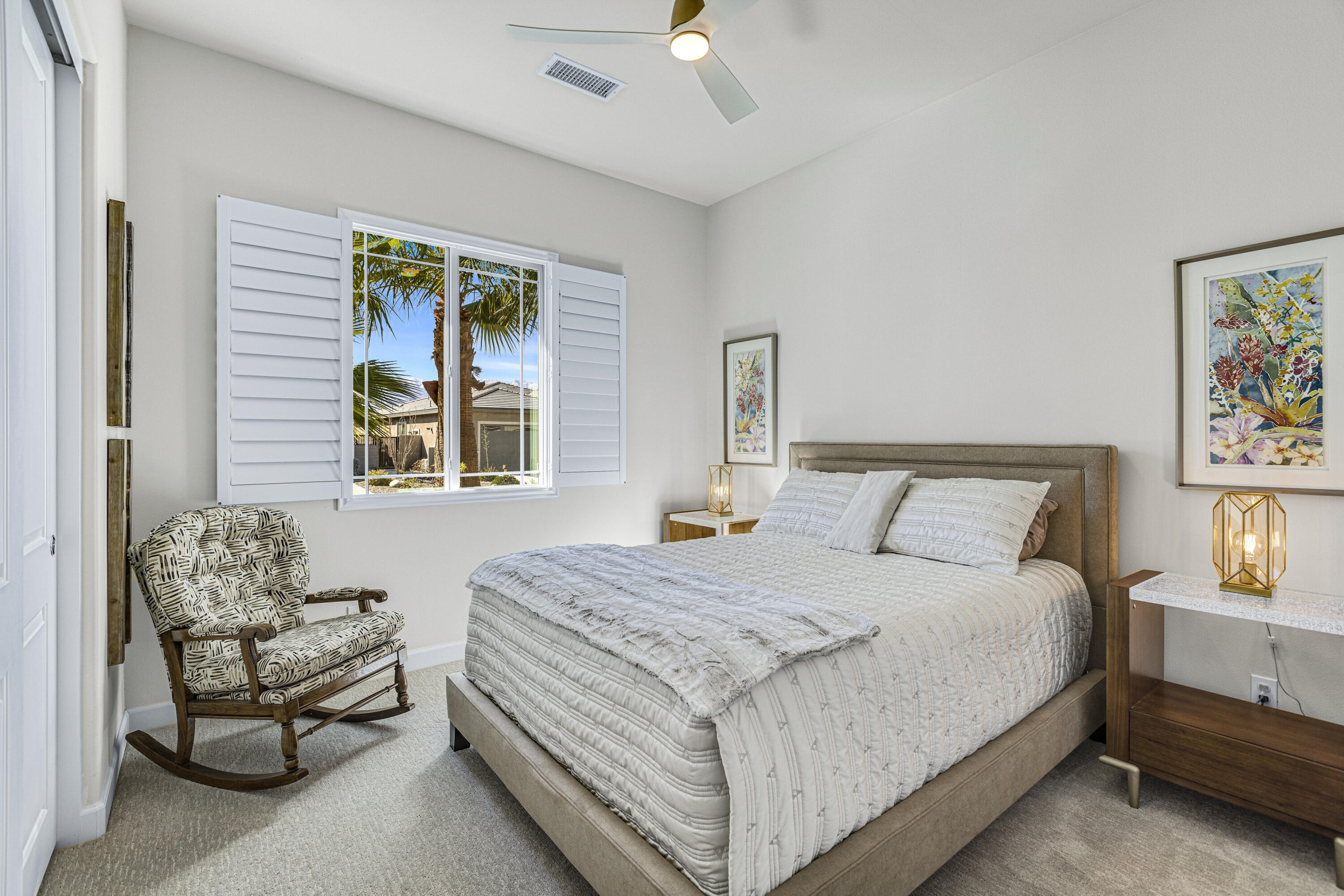 36 Chianti Rancho Mirage, CA 92270 - Photo 43 of 63 a bedroom with a bed and a chandelier