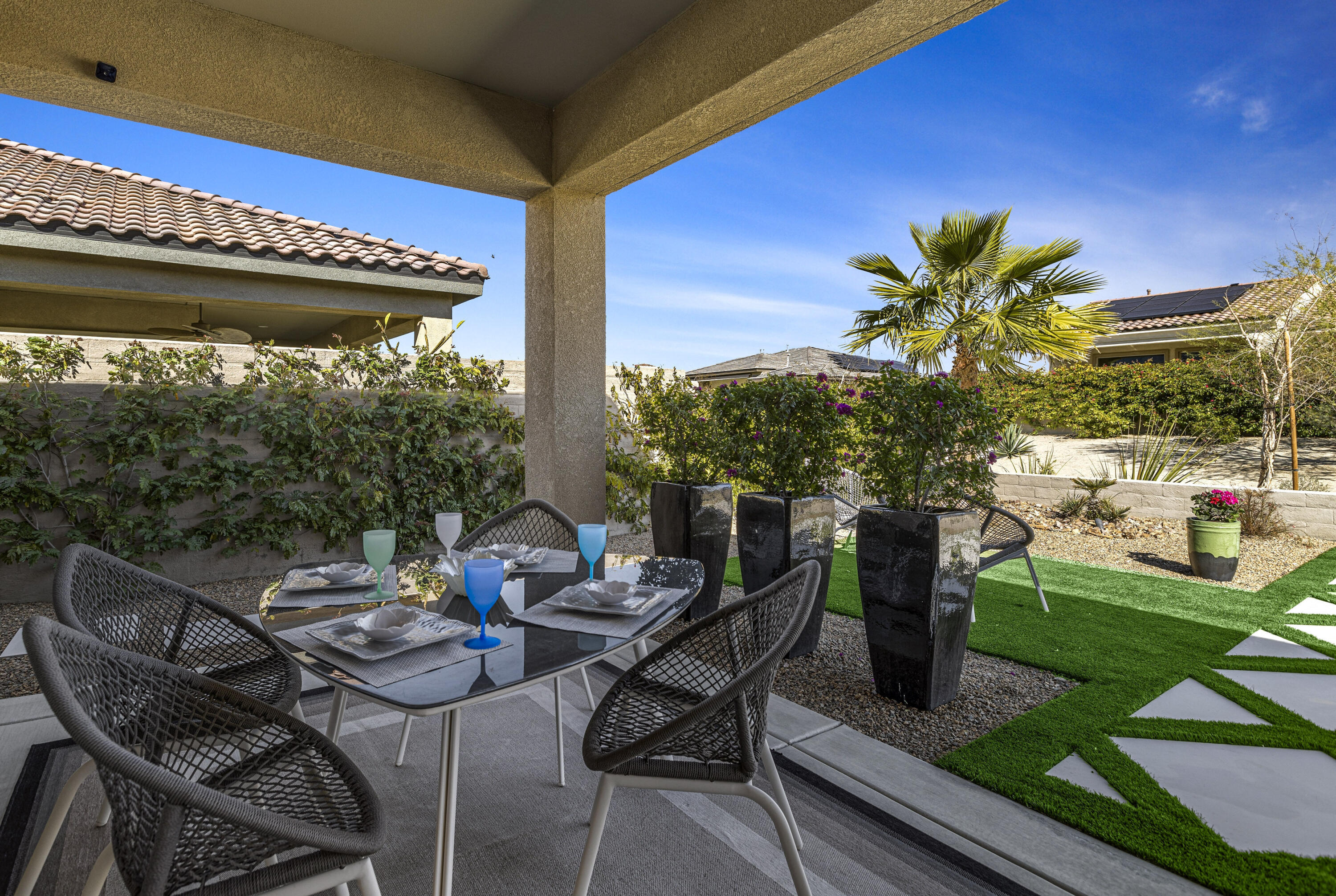 36 Chianti Rancho Mirage, CA 92270 - Photo 46 of 63 a view of a patio with table and chairs and potted plants