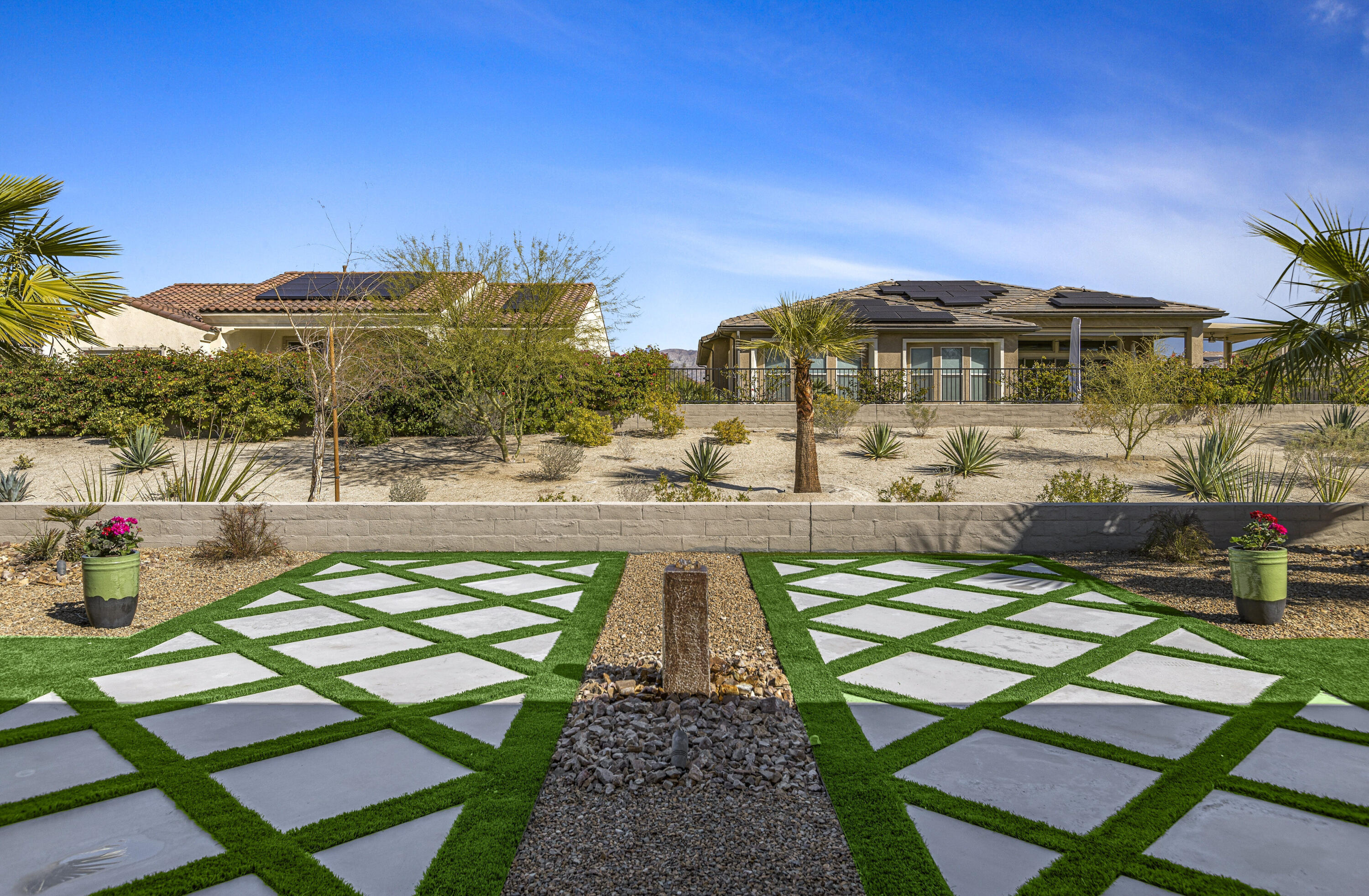 36 Chianti Rancho Mirage, CA 92270 - Photo 49 of 63 a view of a swimming pool with a lounge chairs