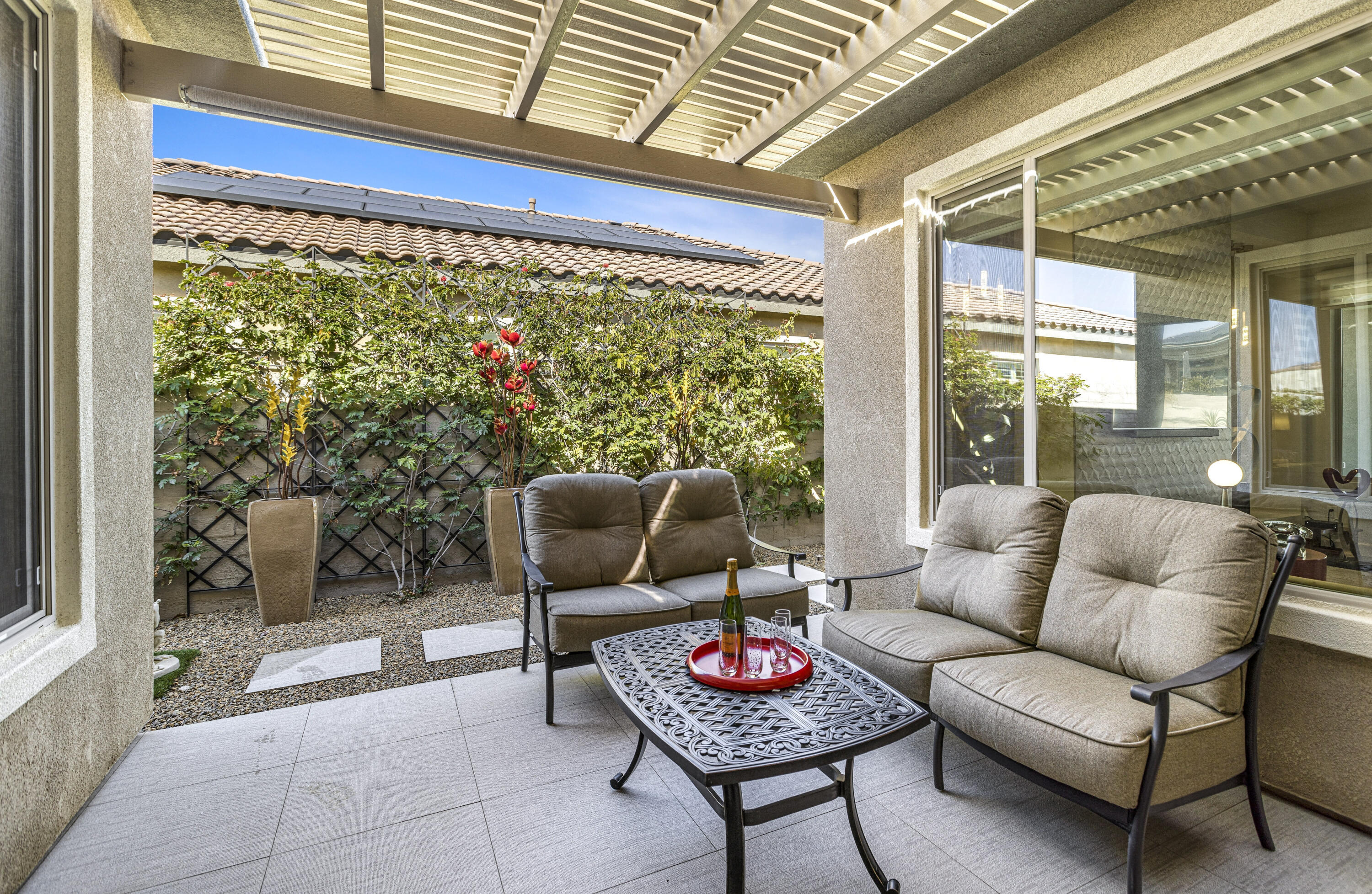 36 Chianti Rancho Mirage, CA 92270 - Photo 54 of 63 a living room with furniture a rug and a large window