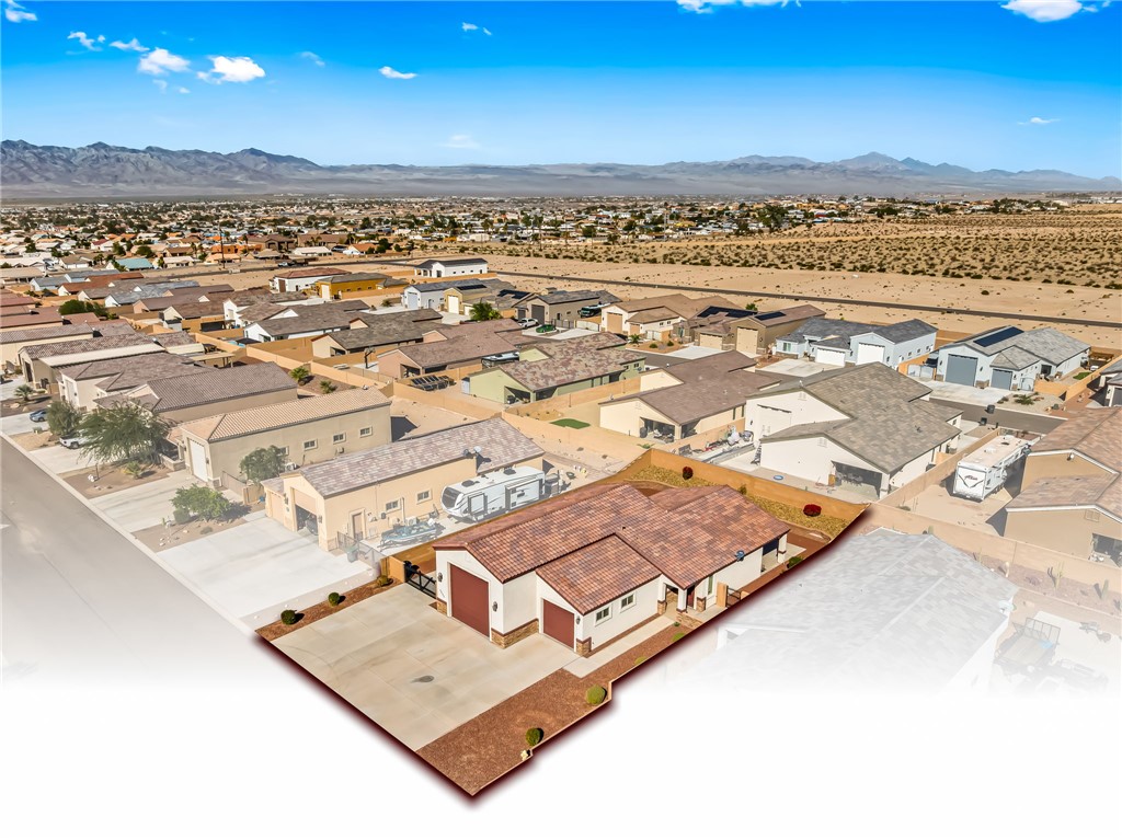 2605 Nez Perce Road Fort Mohave, AZ 86426 - Photo 3 of 53 Aerial perspective of suburban area featuring a mountain backdrop