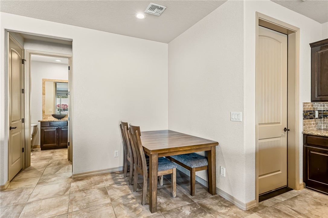 2605 Nez Perce Road Fort Mohave, AZ 86426 - Photo 7 of 53 Dining space featuring recessed lighting, light tile patterned floors, and a textured ceiling