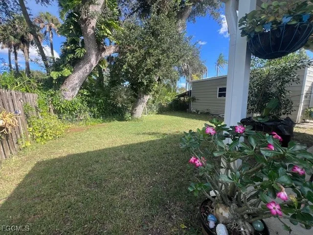 a view of yard with flower and trees
