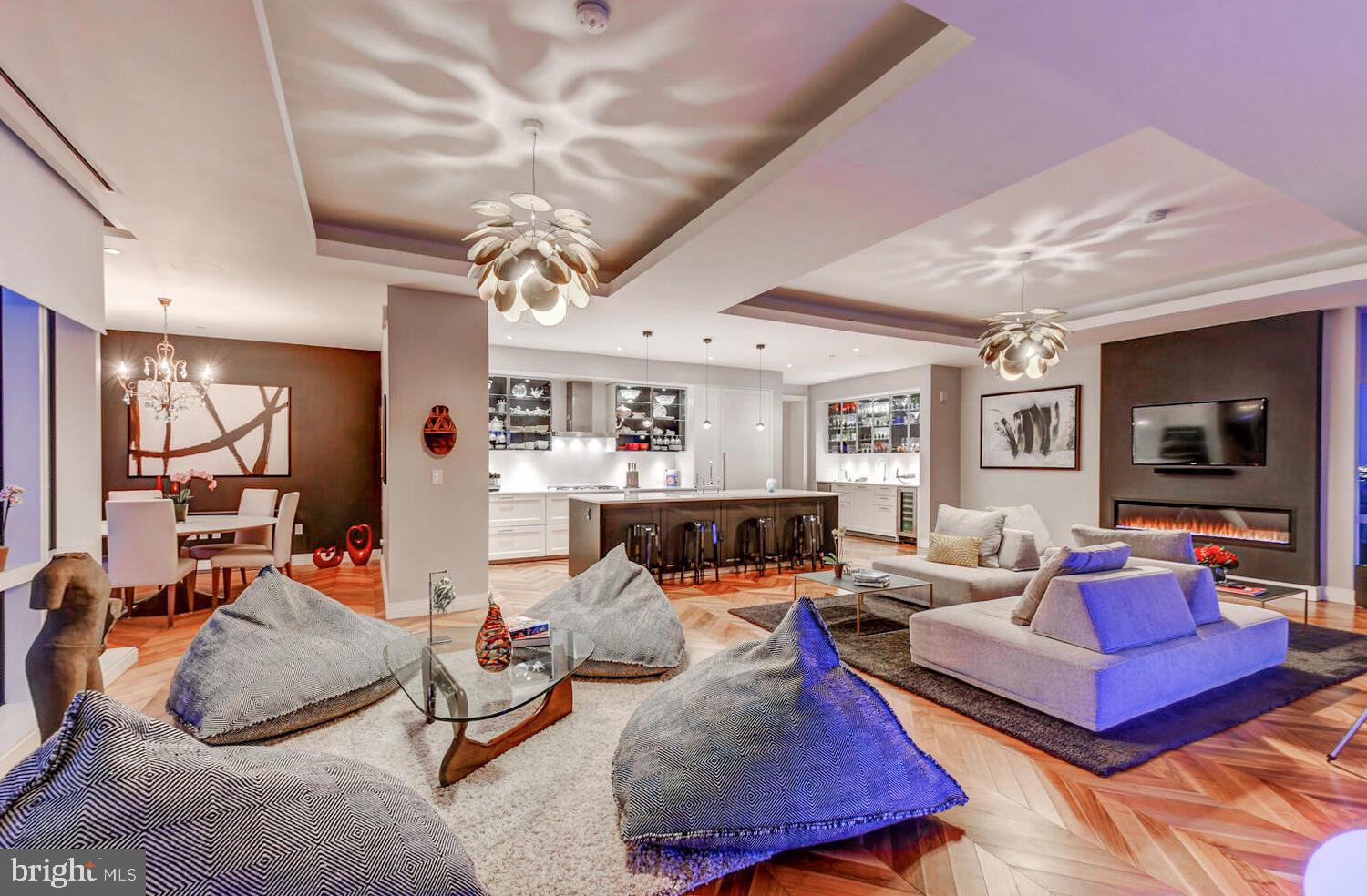 300 International Drive, Unit 2301 Baltimore, MD 21202 - Photo 14 of 37 a living room with furniture and wooden floor