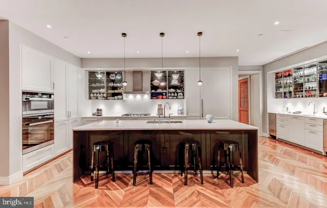 a kitchen with stainless steel appliances granite countertop a sink and cabinets