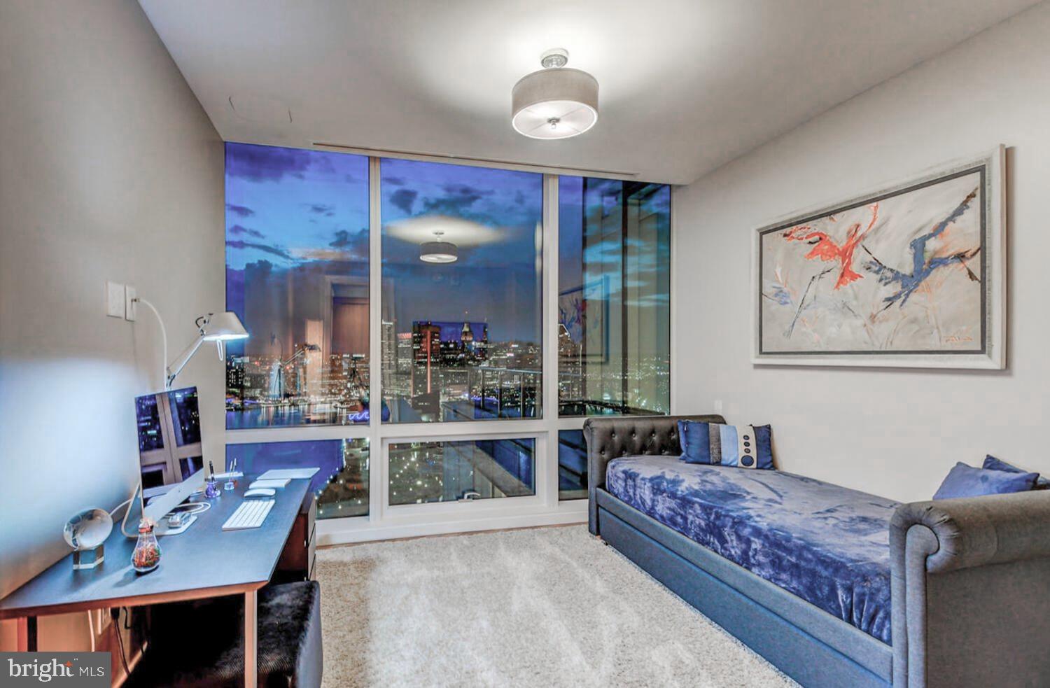 300 International Drive, Unit 2301 Baltimore, MD 21202 - Photo 33 of 37 a living room with furniture and a large window