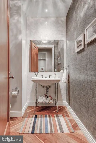 a bedroom with a bed and a mirror