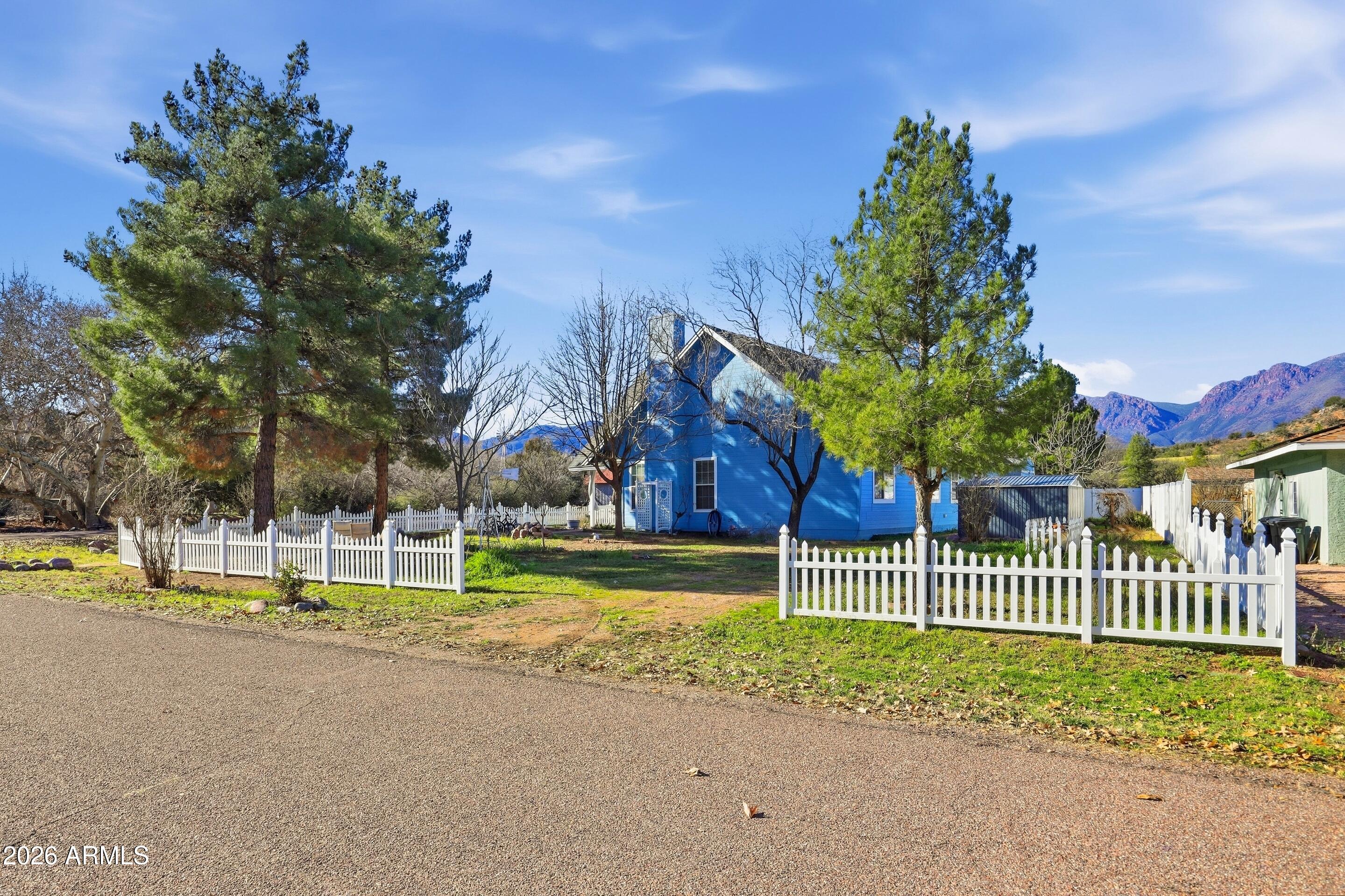228 Windmill Road Payson, AZ 85541 - Photo 11 of 42 a view of a house with a small yard and large trees