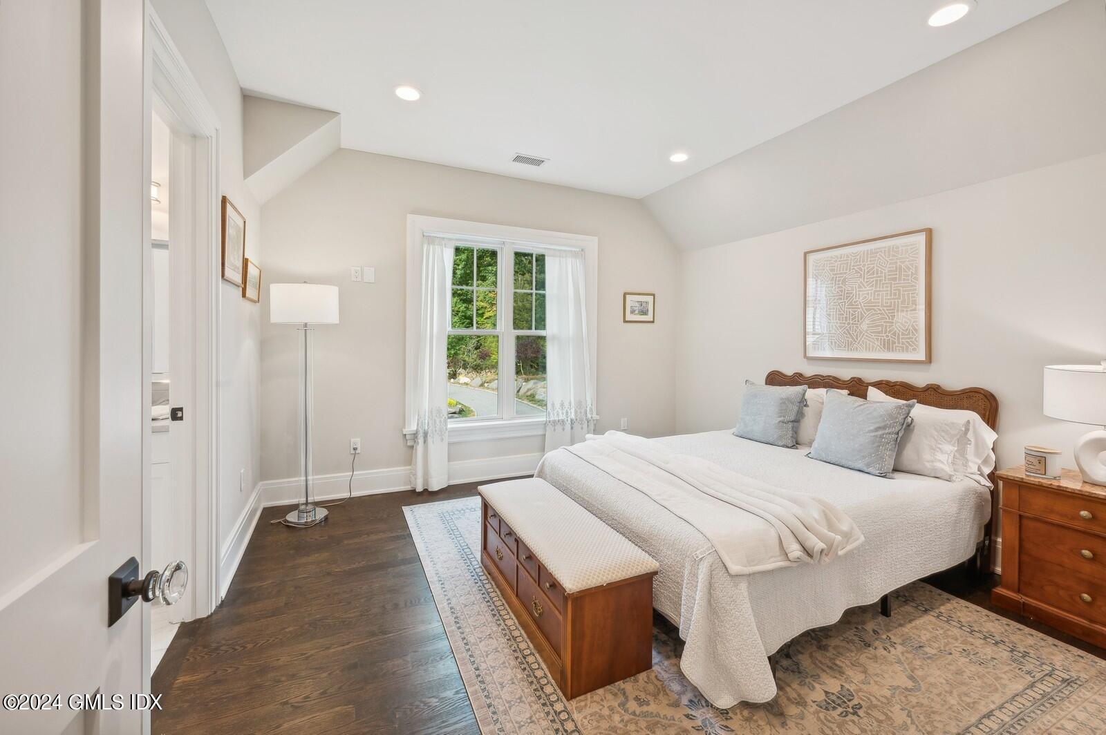 155 Cat Rock Road Cos Cob, CT 06807 - Photo 15 of 29 a bedroom with a bed and a window