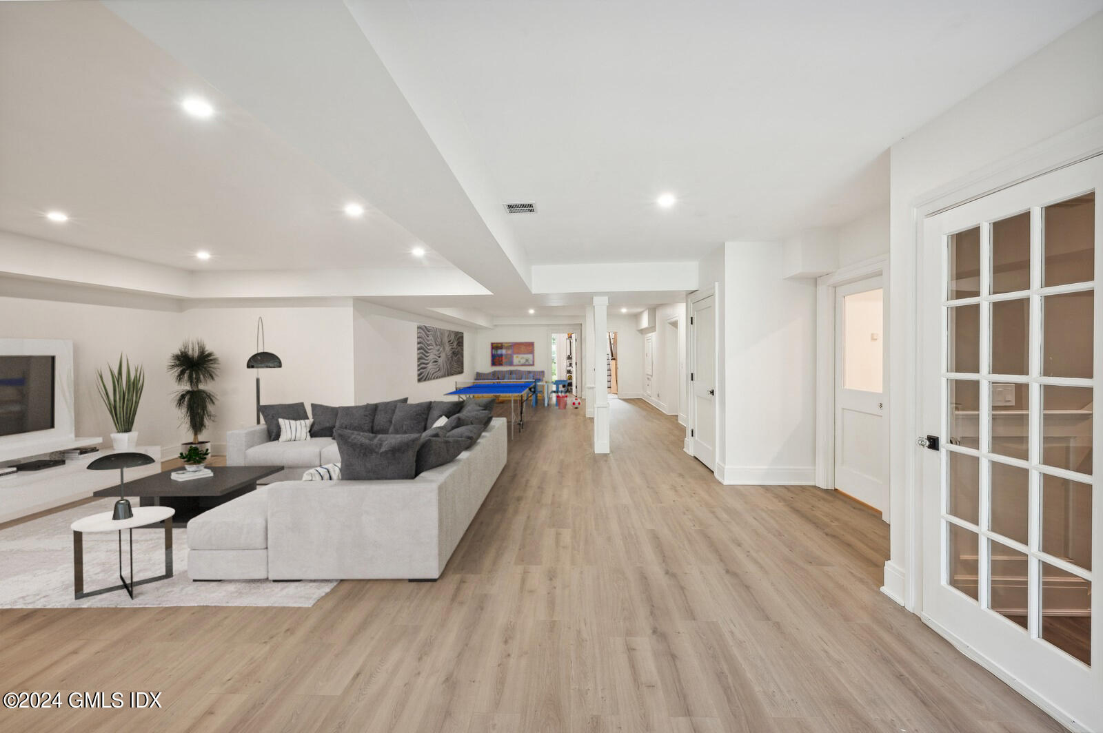 155 Cat Rock Road Cos Cob, CT 06807 - Photo 23 of 29 a living room with furniture and a wooden floor