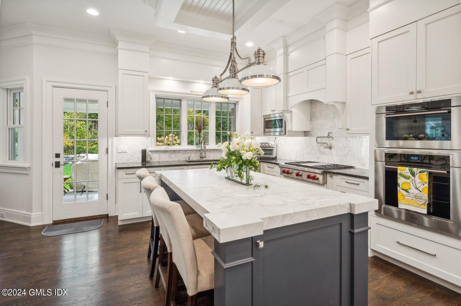 155 Cat Rock Road Cos Cob, CT 06807 - Photo 8 of 29 a kitchen with a stove a sink and a refrigerator