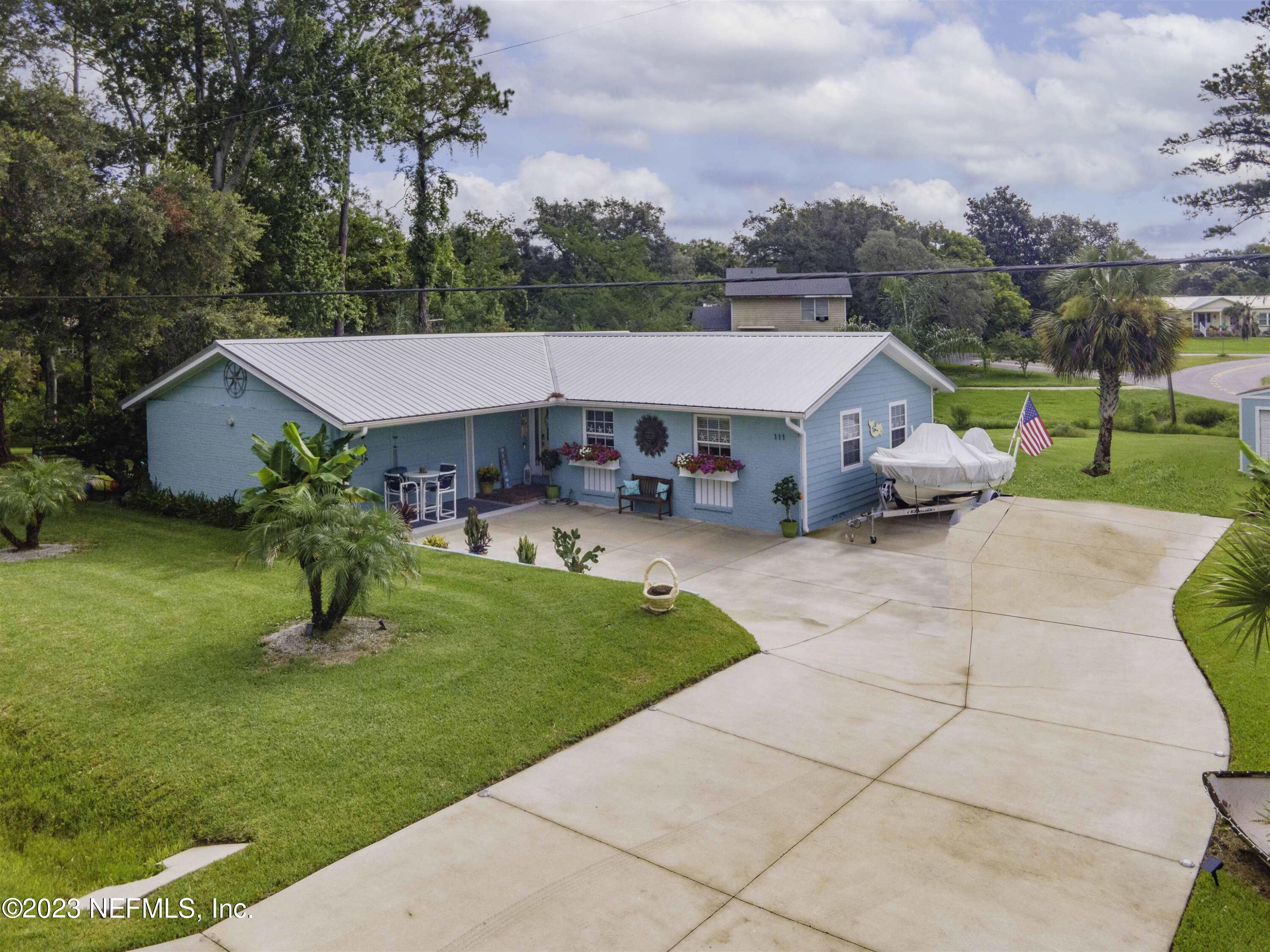 111 Loyola Road St. Augustine, FL 32086 - Photo 1 of 67 a aerial view of a house with garden and trees