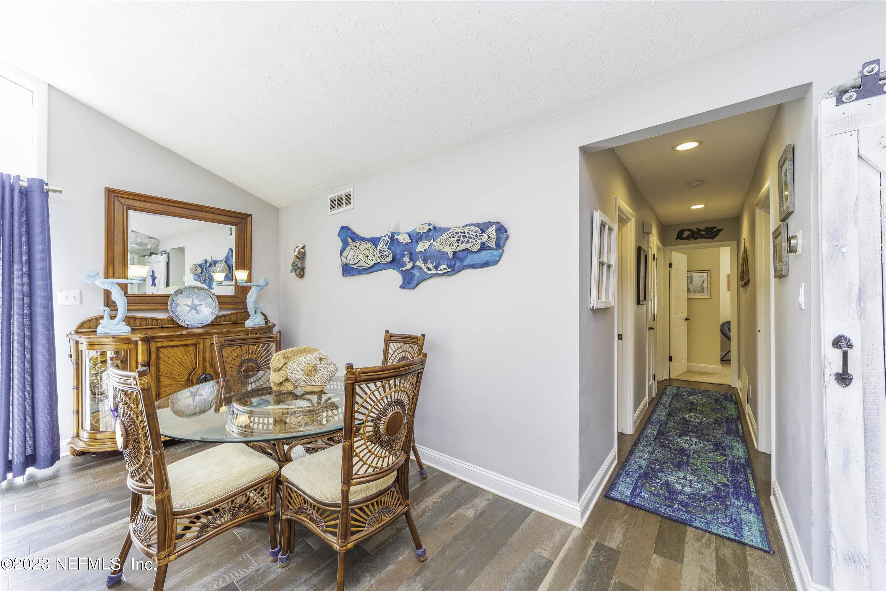 111 Loyola Road St. Augustine, FL 32086 - Photo 13 of 67 a dining room with furniture and wooden floor