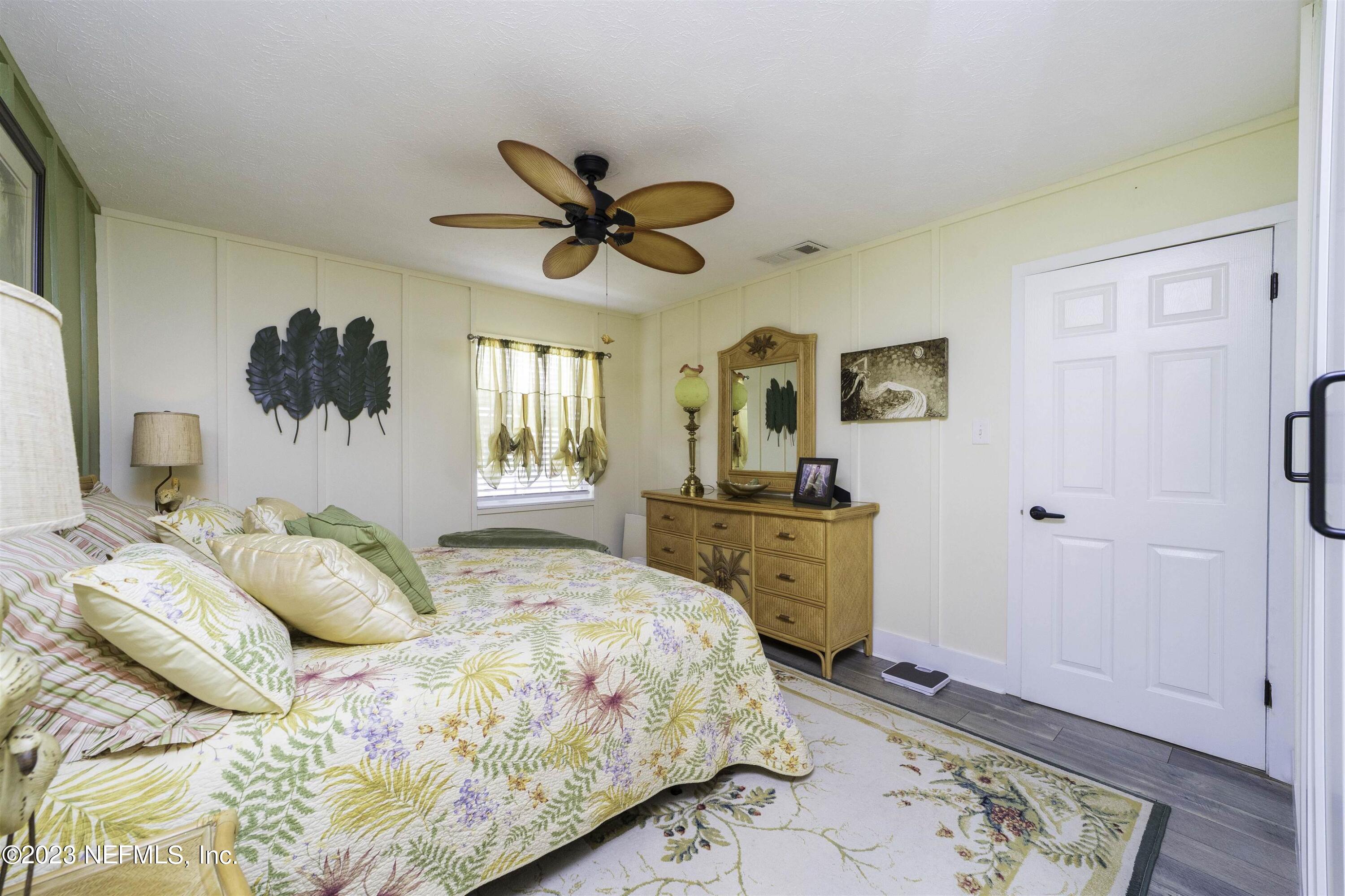 111 Loyola Road St. Augustine, FL 32086 - Photo 26 of 67 a bedroom with a bed dresser and a window