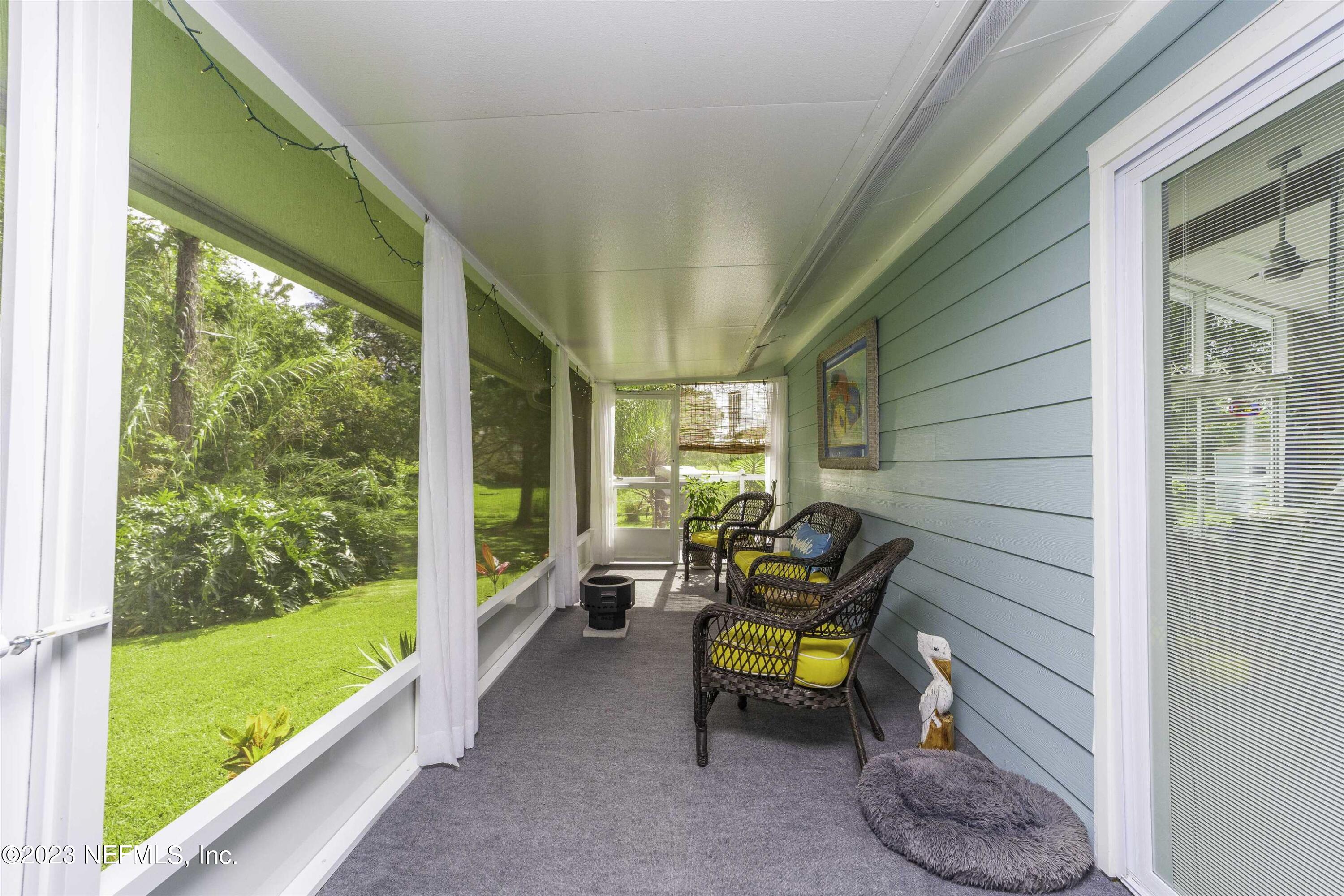 111 Loyola Road St. Augustine, FL 32086 - Photo 43 of 67 a sitting area with swimming pool in the back