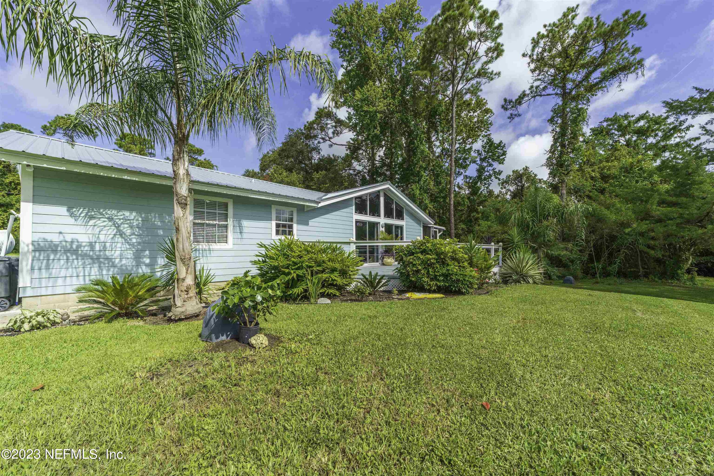111 Loyola Road St. Augustine, FL 32086 - Photo 51 of 67 a house with a garden