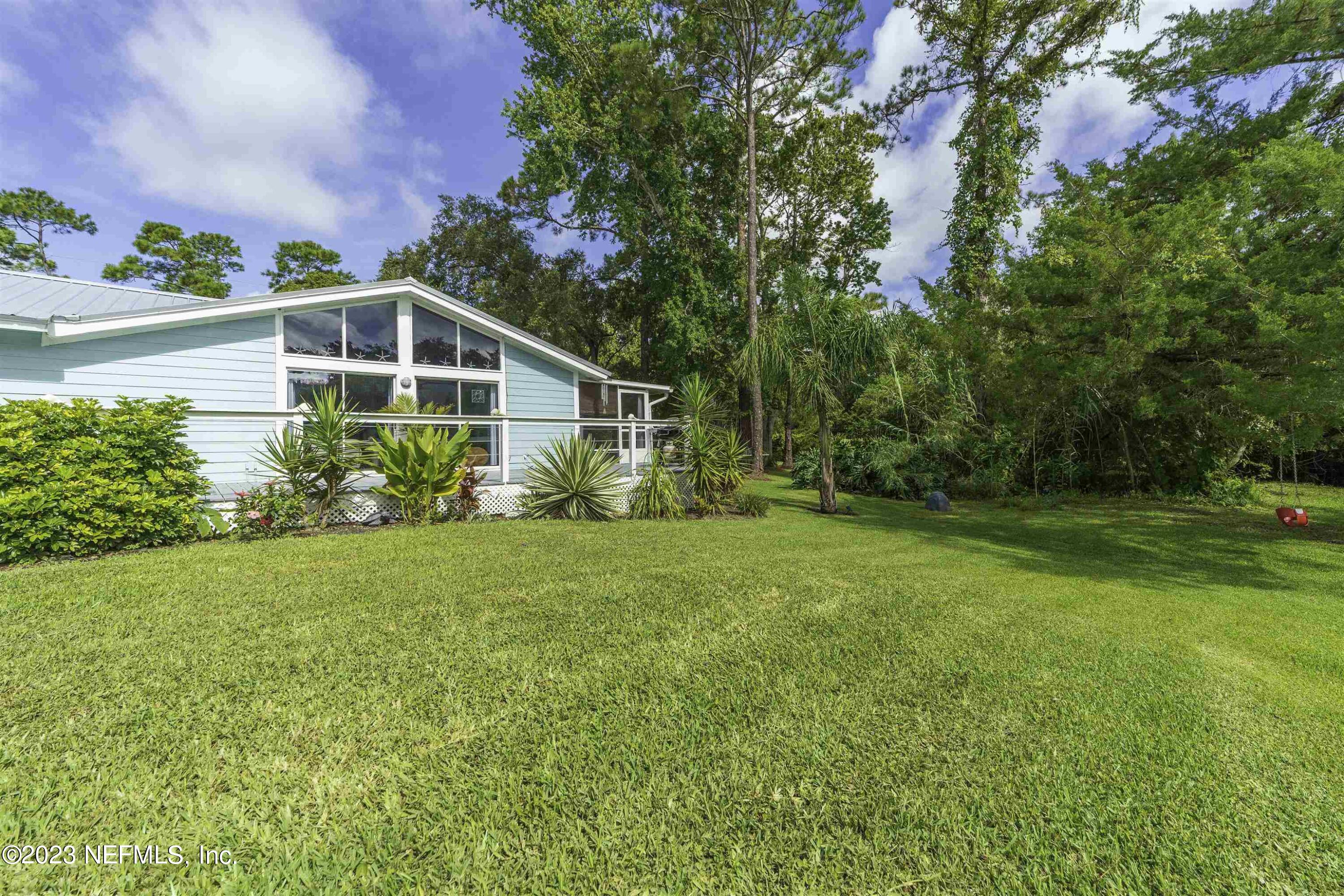 111 Loyola Road St. Augustine, FL 32086 - Photo 52 of 67 a front view of a house with garden