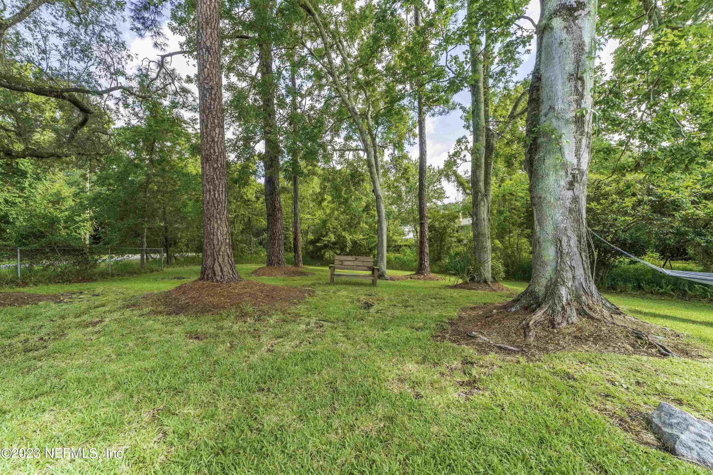 111 Loyola Road St. Augustine, FL 32086 - Photo 54 of 67 a view of outdoor space with deck and yard