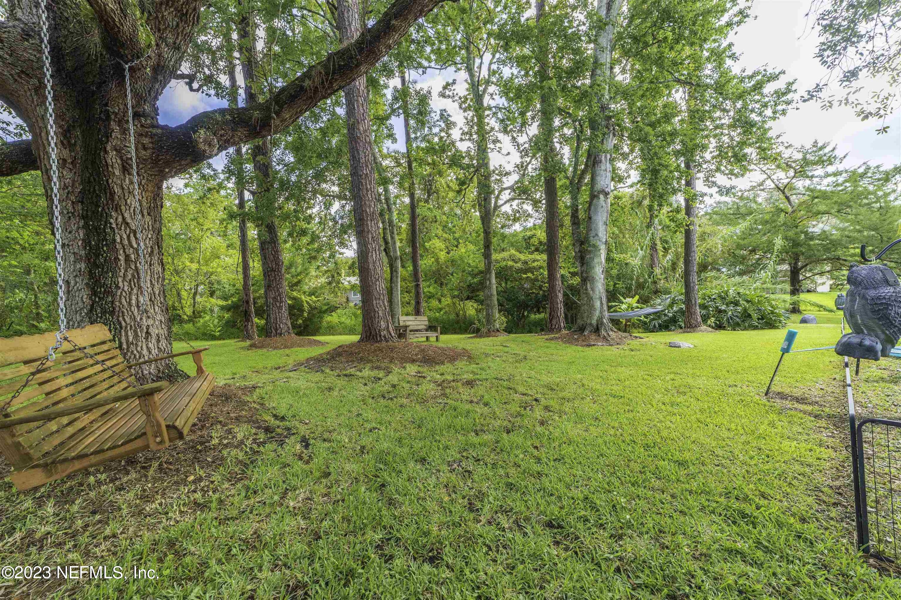 111 Loyola Road St. Augustine, FL 32086 - Photo 55 of 67 a view of a yard with swimming pool