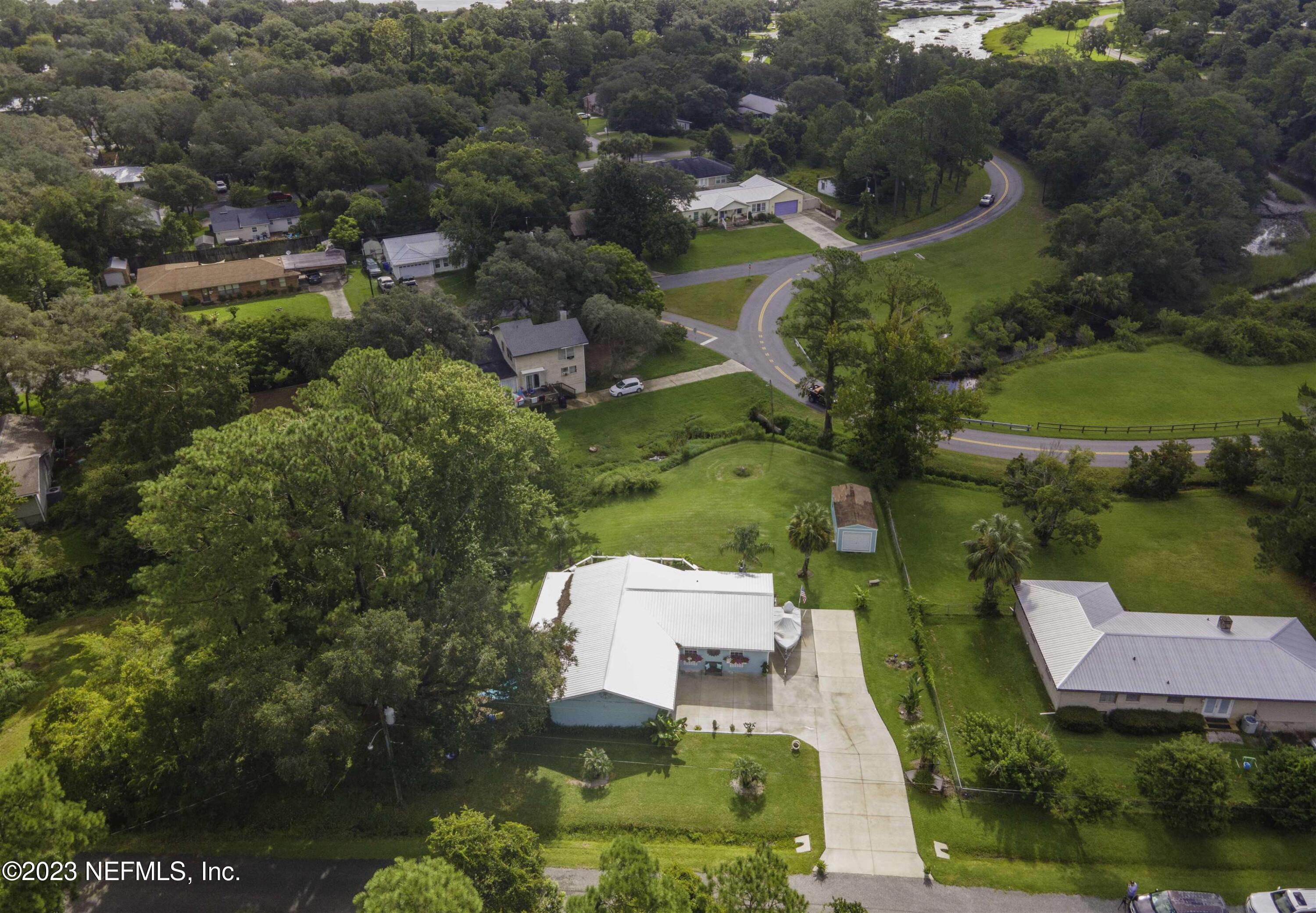 111 Loyola Road St. Augustine, FL 32086 - Photo 61 of 67 an aerial view of house with yard swimming pool and outdoor seating