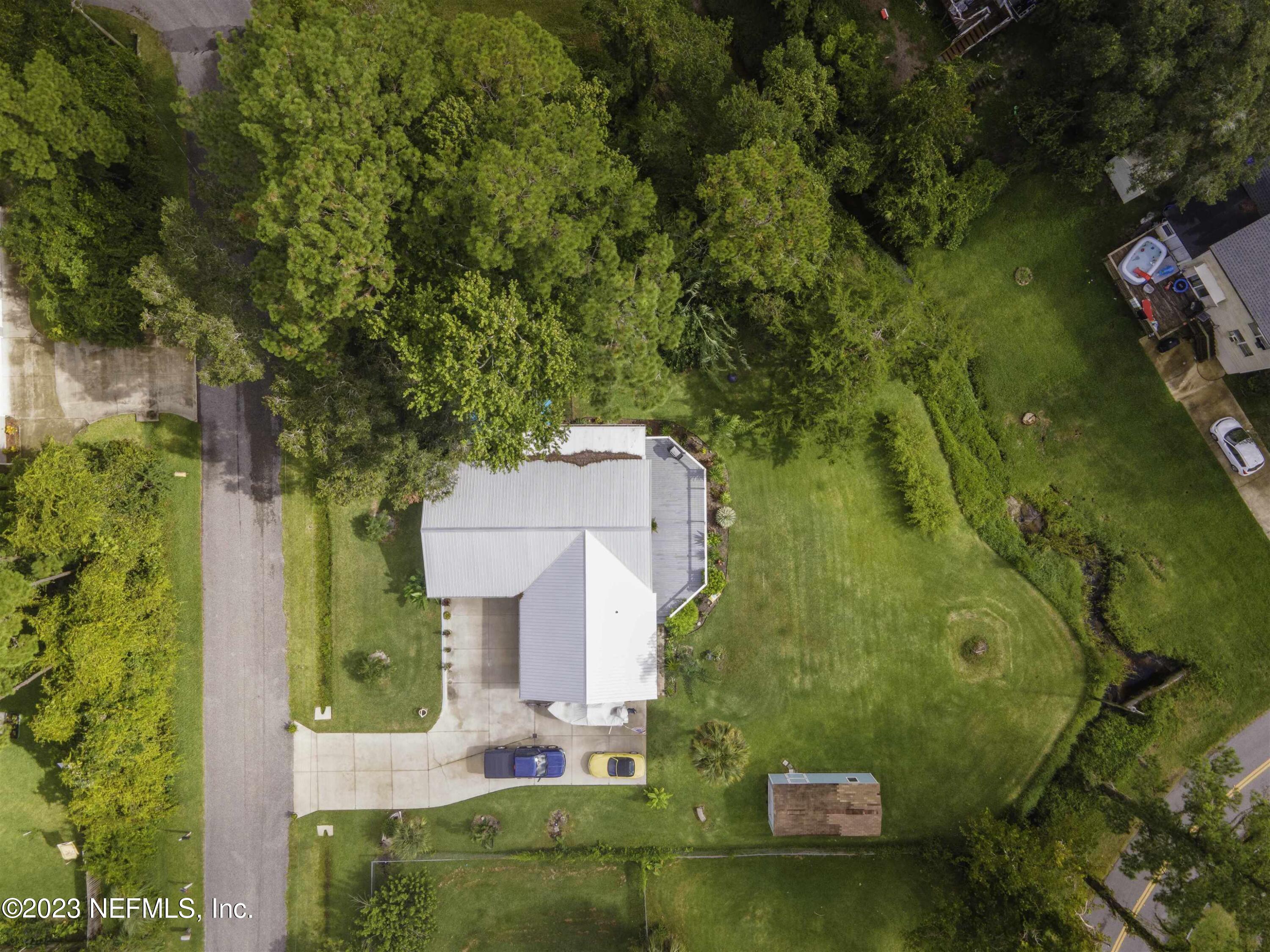111 Loyola Road St. Augustine, FL 32086 - Photo 63 of 67 an aerial view of a house with a yard