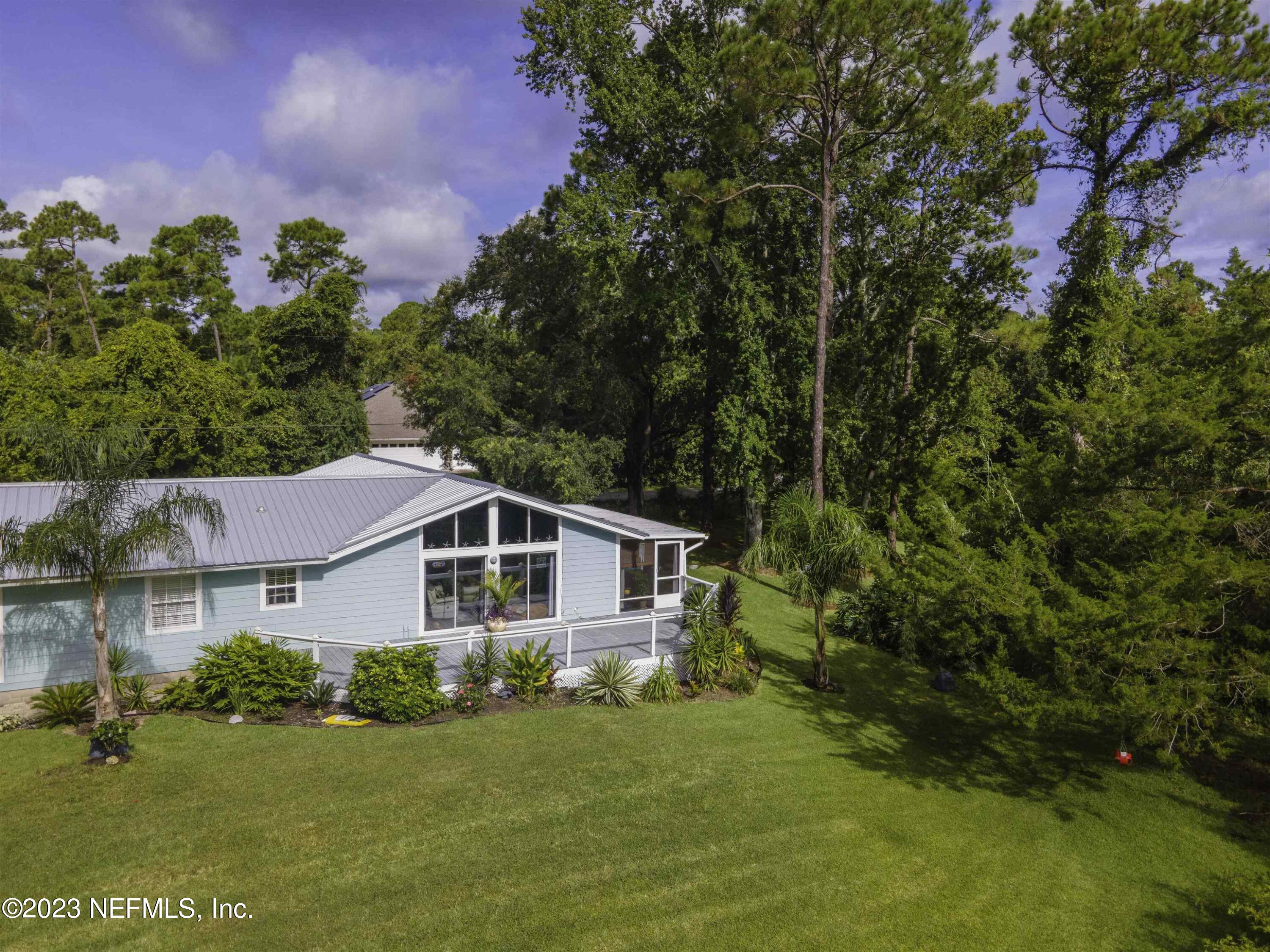 111 Loyola Road St. Augustine, FL 32086 - Photo 66 of 67 a aerial view of a house with a yard