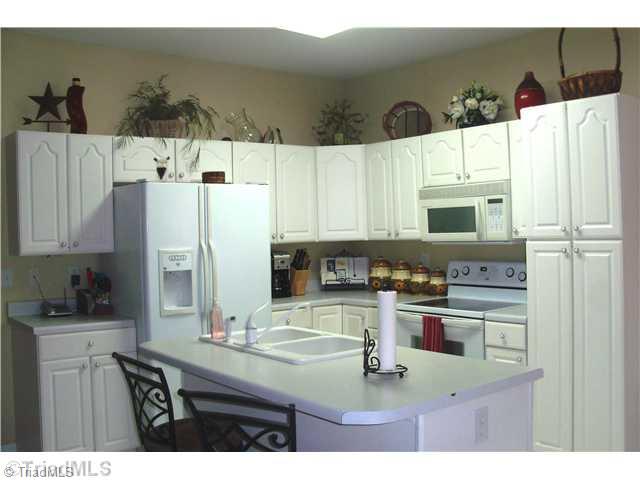 8811 Circle Rural Hall Nc 27045 Rural Hall, NC 27045 - Photo 5 of 16 Kitchen. Convenient kitchen with island, pantry, and lot of cabinets.