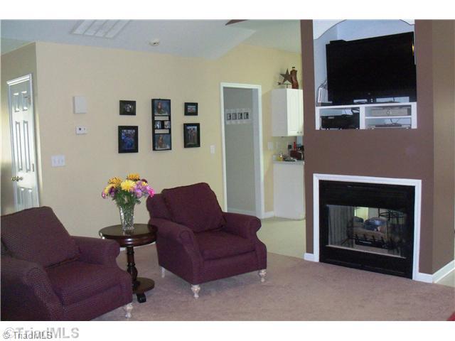 8811 Circle Rural Hall Nc 27045 Rural Hall, NC 27045 - Photo 7 of 16 Living Room. Dual sided fireplace.