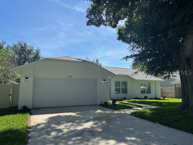 136 Brigadoon Point Orlando, FL 32835 - Photo 1 of 1 a view of a house with a yard