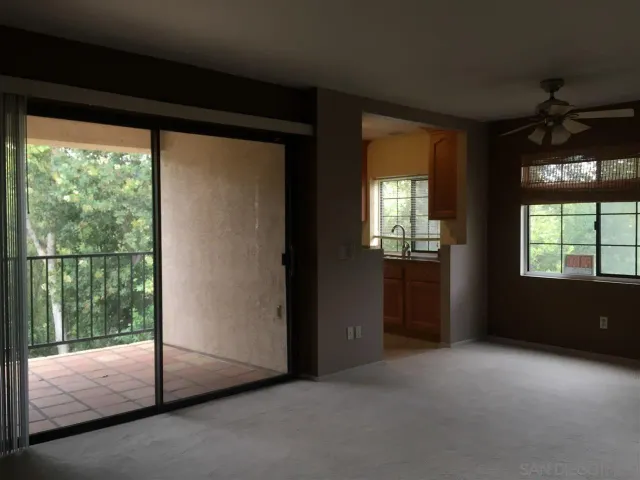 a view of empty room with floor to ceiling window