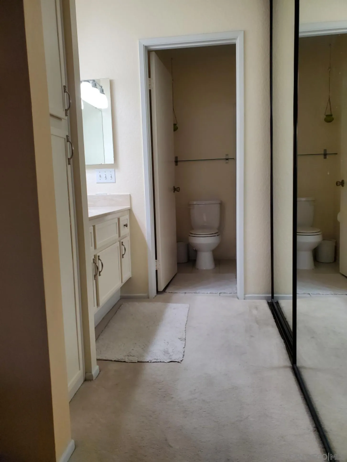 13294 Wimberly Square, Unit 228 San Diego, CA 92128 - Photo 18 of 24 a view of a hallway with closet and a bathroom