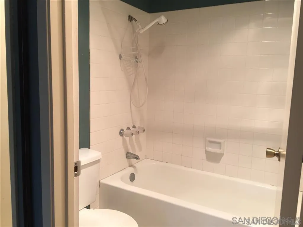 13294 Wimberly Square, Unit 228 San Diego, CA 92128 - Photo 19 of 24 a bathroom with a bathtub and a shower