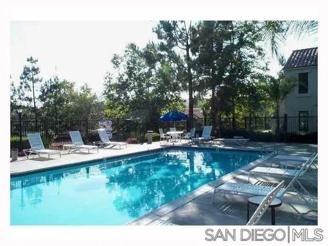 13294 Wimberly Square, Unit 228 San Diego, CA 92128 - Photo 24 of 24 a view of a swimming pool with outdoor seating