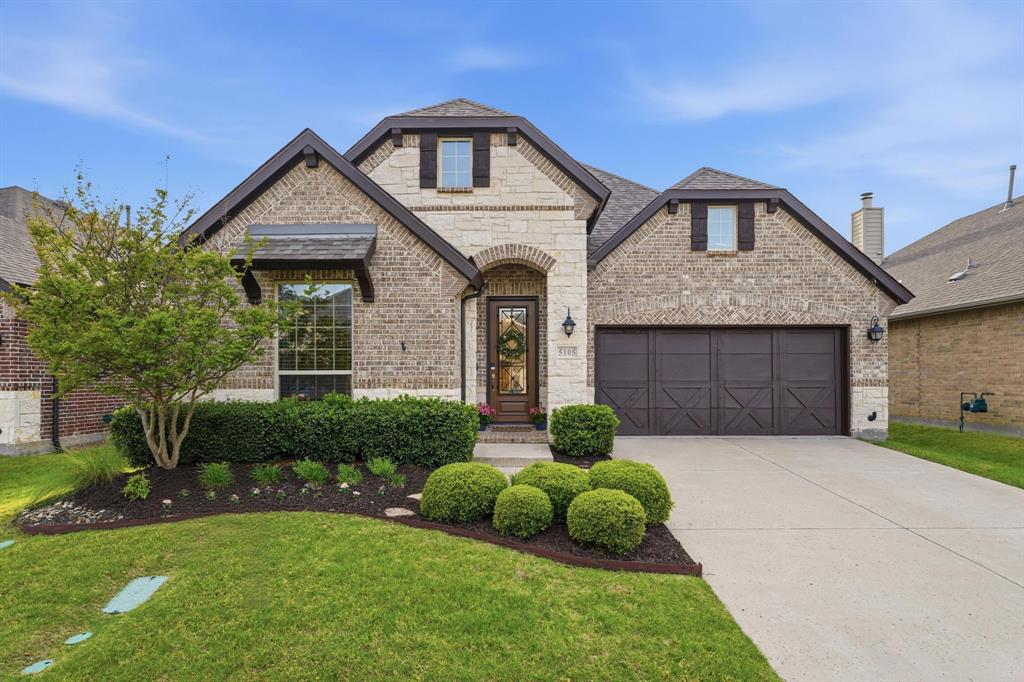5105 Ember Place Little Elm, TX 76227 - Photo 1 of 35 a front view of a house with garden