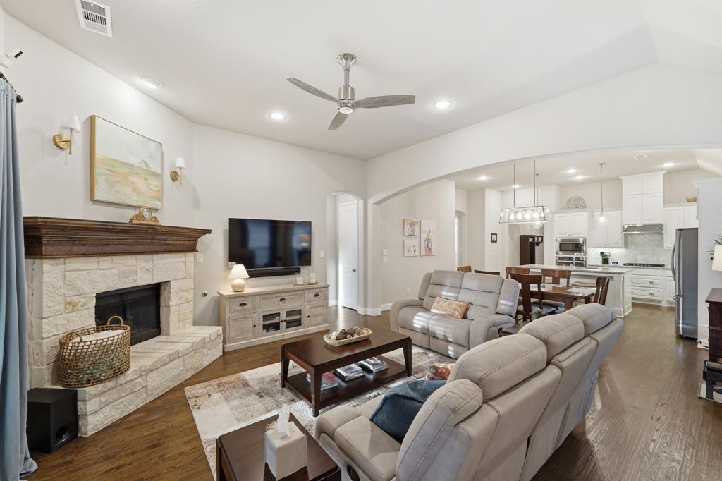 5105 Ember Place Little Elm, TX 76227 - Photo 13 of 35 a living room with furniture fireplace and flat screen tv